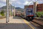 A Hitachi "Rock" EMU rounds the bend into Sestri Levante